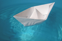 Folding A Ship With Paper